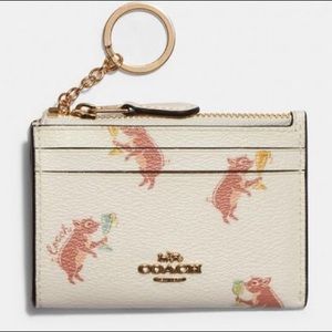 Coach dancing piglet card holder